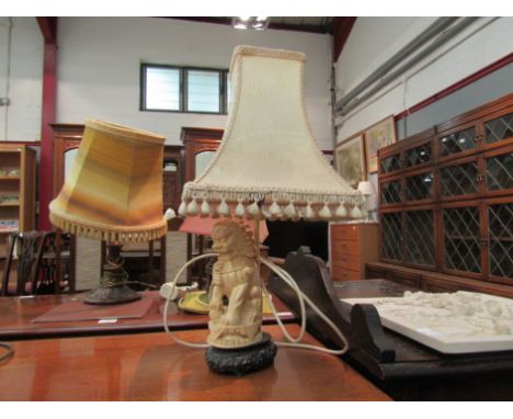 A Temple dog design table lamp base with shade