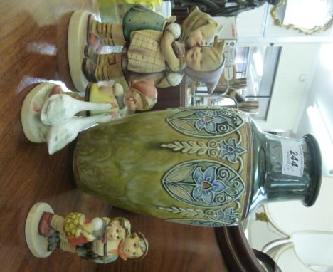 A Royal Doulton Art Nouveau stoneware vase, decorated with stylised flora, on a two tone green ground  12''h; and three Goebe