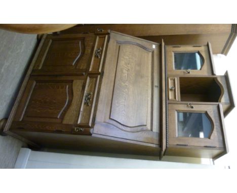 A modern oak bureau, the superstructure having a shelf and drawer, flanked by a pair of glazed doors, over a fall front with 