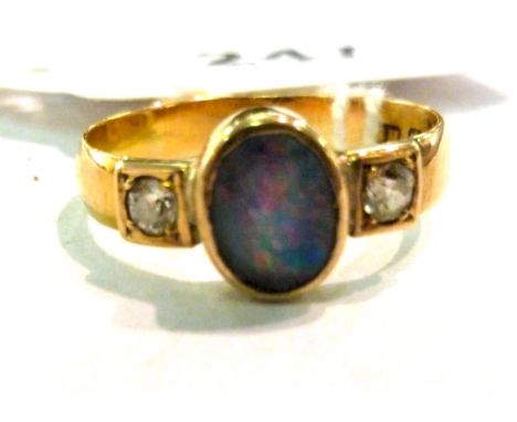 An 18ct gold ring with an opal set between diamond shoulders       11