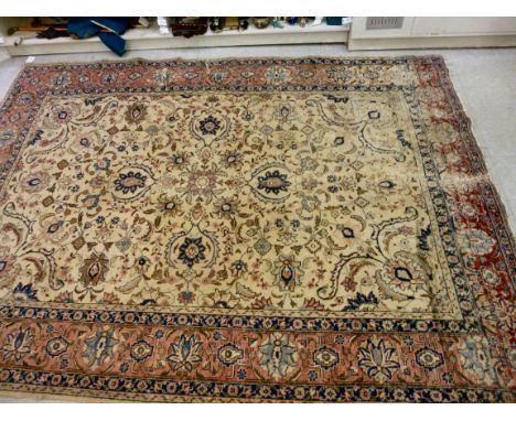 A North West Persian carpet with palmettes, flowers and foliage on a beige ground  123'' x 92''       CA