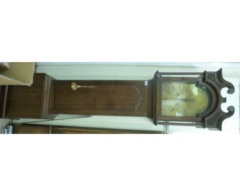 A late 18thC light oak longcase clock, the hood having a fretworked, swan neck pediment, over an arched, glazed panelled door