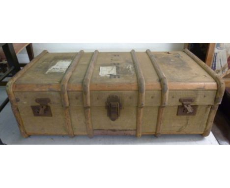 An early 20thC canvas bound cabin trunk, having beech and metal mounts  12''h  36''w       BSR