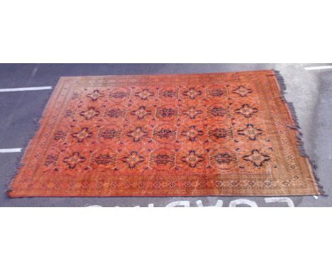 A Bokhara carpet with four columns of octagonal guls on red ground  157'' x 222''          CA