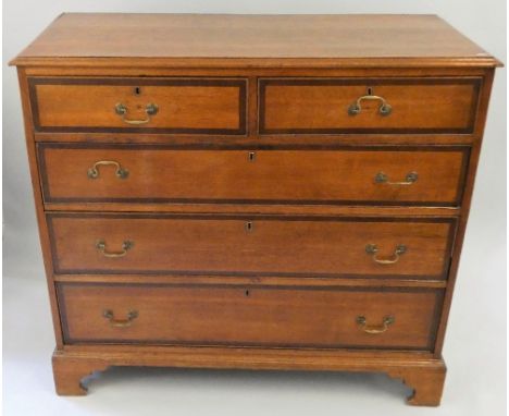 A 19th century oak chest of drawers, composed of two short over three long drawers with a mahogany edge, raised on bracket fe