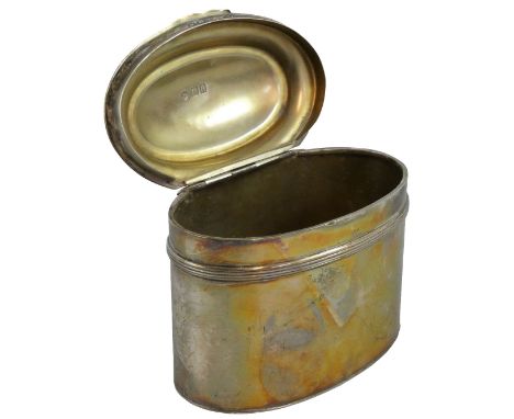 An Edwardian silver tea caddy, London 1908, of oval form, with applied reeded band and domed cover, weight 4.5 oz, length 9.5