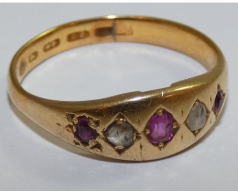 A Victorian 22ct gold ruby and diamond five stone ring, Birmingham 1864, star set with old cut stones, weight 4.5 grams, size