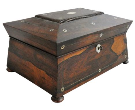 A first half 19th century rosewood and mother of pearl inlaid sewing box, of sarcophagus form, with bead moulding fitted inte