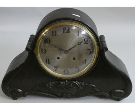 Lorenz Furtwangler &amp; Sohne - a French oak mantle clock, of scroll form, the silvered dial with Arabic numerals, the movem