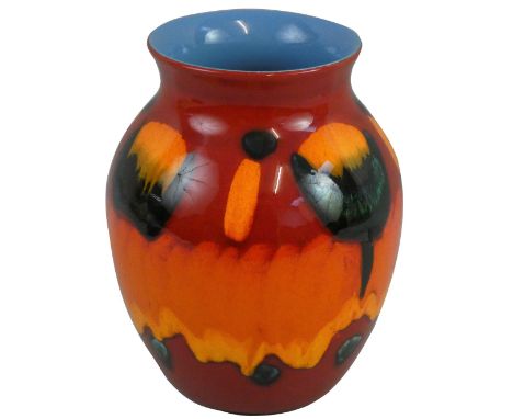 A Poole Pottery vase in the 'Volcano' pattern, with green yellow glaze on a red ground, printed factory marks, height 24 cm, 