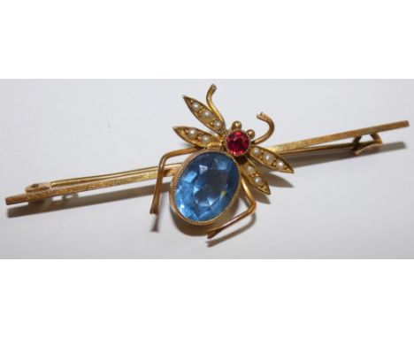 A 9ct gold bug brooch, the milligrain collet set blue paste thorax with red paste head, half pearl set wings, length of bar 5