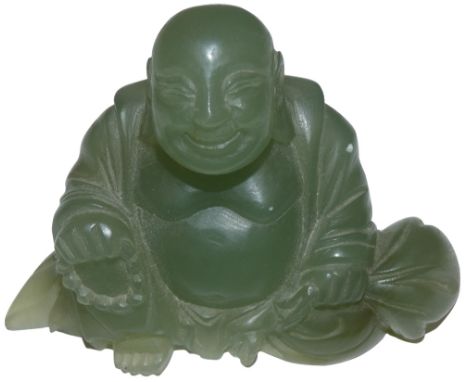 A green jade seated Buddha, height 7.5 cm.