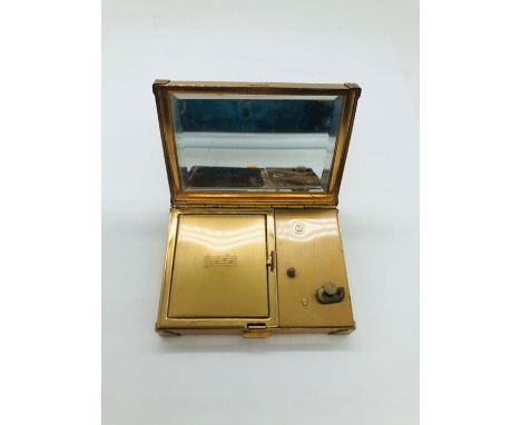A vintage AGME ladies compact, made in Switzerland.