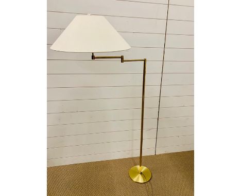 A single light swing arm floor lamp in bronze finish with cream shade 