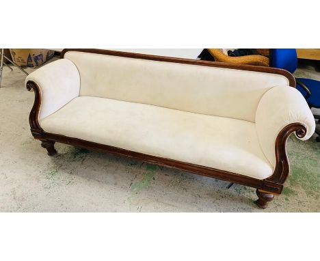 An Empire line upholstered scroll end sofa