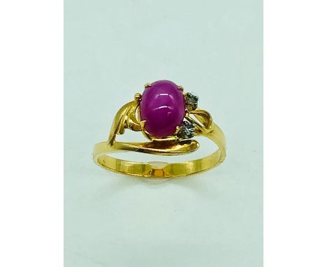 A 14ct yellow gold, star ruby and diamond ring.