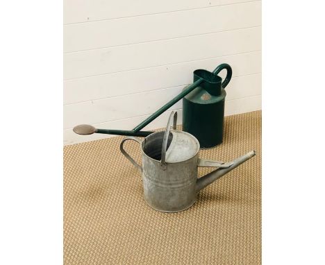 Two vintage metal watering cans 