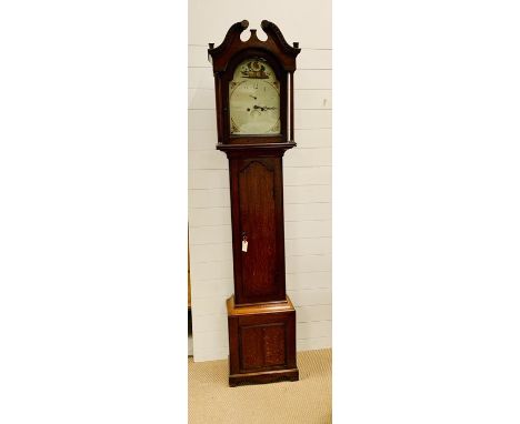 A George III oak and mahogany longcase clock, arched white dial, count wheel movement striking on a bell (H218cm D25cm W47cm)