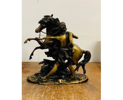 A spelter/bronze figure of a man and horse 