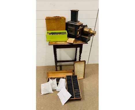 A vintage slide projector by Newton and Co scientific instrument makers, to include a large selection of slides of fairy tale