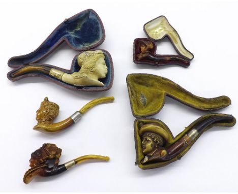 Three cased carved Meerschaum pipes depicting portrait busts of ladies; together with two other uncased pipes (5)