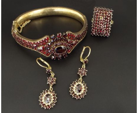 Attractive Bohemian garnet gilt bangle, stamped '900'; similar rectangular stepped ring and a a pair of garnet and pearl drop