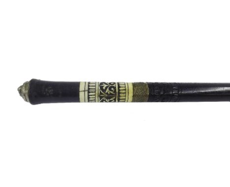 Anglo-Indian ebony and bone swordstick, the top mounted with a lion head knop, the steel blade etched with scrolled foliage, 