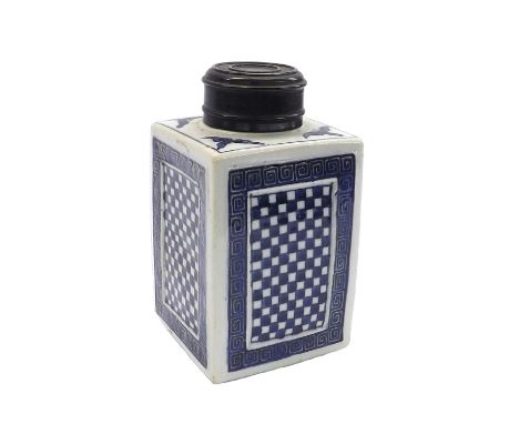 Chinese blue and white tea caddy of square panelled form, with chequered panelled decoration within Greek key borders to each