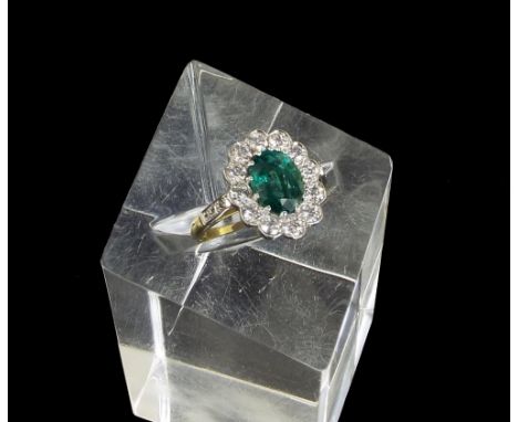 Impressive 18ct emerald and diamond oval cluster ring, the emerald 1.85ct approx in a surround of round brilliant-cut diamond