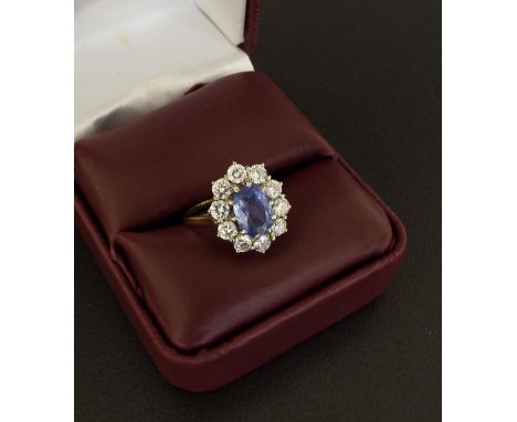 18ct sapphire and diamond oval cluster ring, the centre stone with a surround of ten round brilliant-cut diamonds, 1ct approx