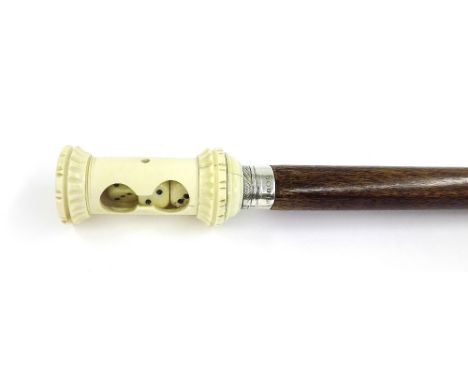 Interesting antique gaming stick, the ivory knop in the form of a shaker with dice, with silver collar, 37" high