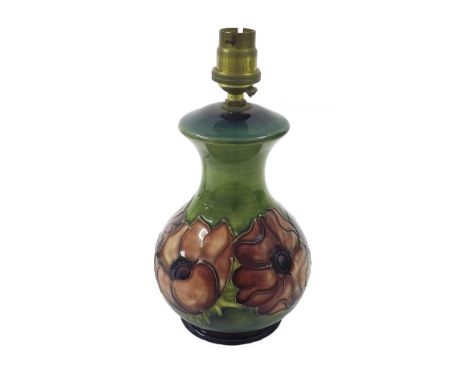 Moorcroft 'Clematis' pattern small baluster table lamp decorated upon a green ground, height of base 7" excluding the light f