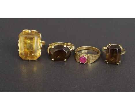 Four stone set 9ct dress rings to include citrine, two smokey quartz and ruby, 22.2gm (4)