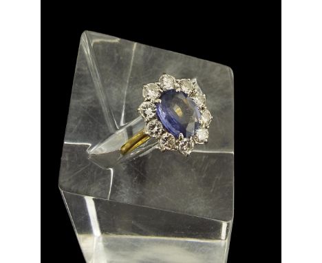 (536491-1-A) 18ct sapphire and diamond oval cluster ring, the centre stone with a surround of ten round brilliant-cut diamond