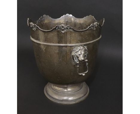 Edwardian silver ice bucket, the wavy rim cast with cherub heads above twin lion head handles, maker William Hutton & Sons, B