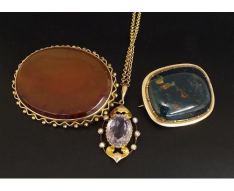 9ct amethyst and pearl pendant on a slender chain, 7gm; with two gold mounted hardstone brooches