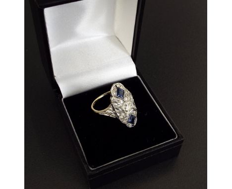 Good 18ct sapphire and diamond cluster ring in the Art Deco style, with two lozenge blue sapphires in a surround of round-cut