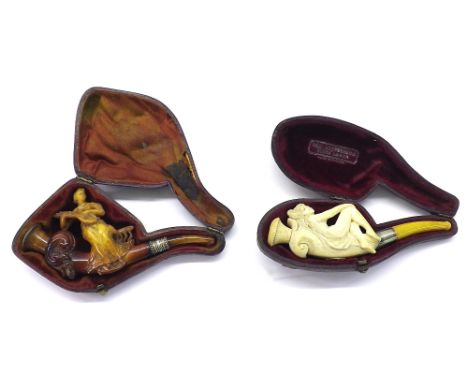 Carved Meerschaum pipe modelled with a lady playing a mandolin, 4.75" long, cased; together with another cased Meerschaum pip