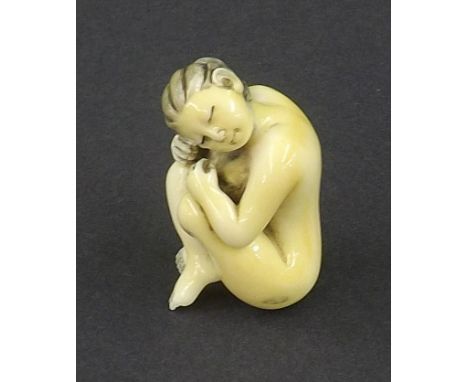 Japanese ivory netsuke modelled as a nude female, signed, 1.75" high