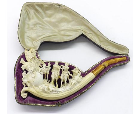 Finely carved Meerschaum pipe depicting a battle scene, 7.5" long (a.f), cased
