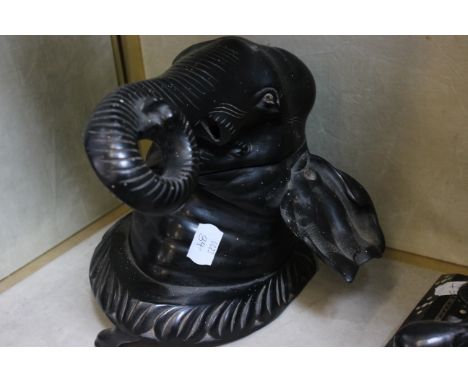 An elephant mask lidded box, 19cm high approx. an elephant decorated desk tidy, an elephant handled stick and a white metal e