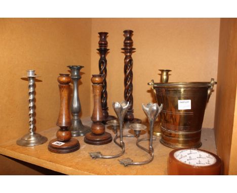 A pair of wooden candlesticks, a brass candlestick, wooden bowls and treen etc