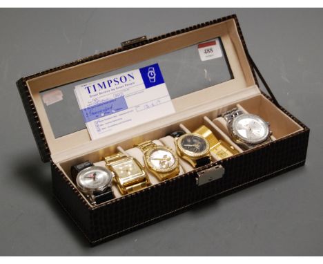 A gents Guess gold plated cased wristwatch, having mother of pearl dial with Arabic numerals and three further subsidiary dia