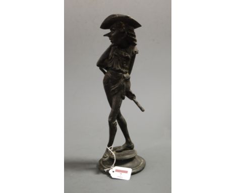 A late 19th century French spelter figural candlestick in the form of Cyrano de Bergerac, height 35cm