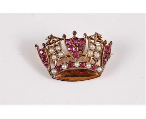 A 9ct ruby and seed pearl naval crown brooch, set with alternating panels of small round rubies and seed pearls, with a lower