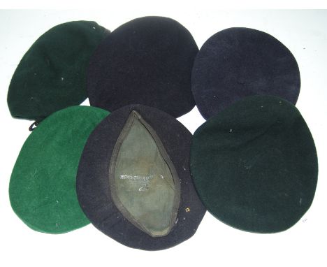 A blue felt beret, stamped British Beret Badge to the interior and dated 1940(?), with broad arrow mark; together with five o