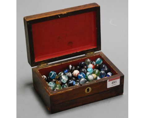 A Victorian rosewood and mother of pearl inlaid unfitted box, containing glass marbles