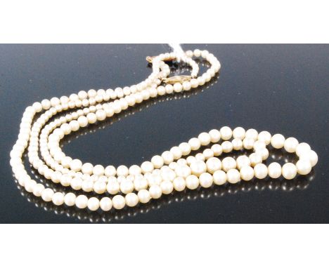 A cultured and graduated pearl single string necklace with 9ct gold clasp, length 42cm, and one other (2)