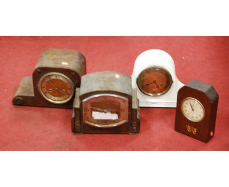 A 1950s oak cased mantel clock, having a silvered dial with Arabic numerals, with chiming movement; together with three other