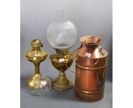 An early 20th century brass oil lamp, having globular glass shade and embossed pedestal base; together with another oil lamp;